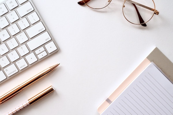 Glasses, pens, notebook, keyboard. Do you have to be a good writer to be a blogger?
